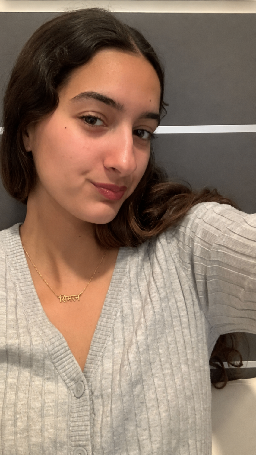 Mira wearing a personalized necklace