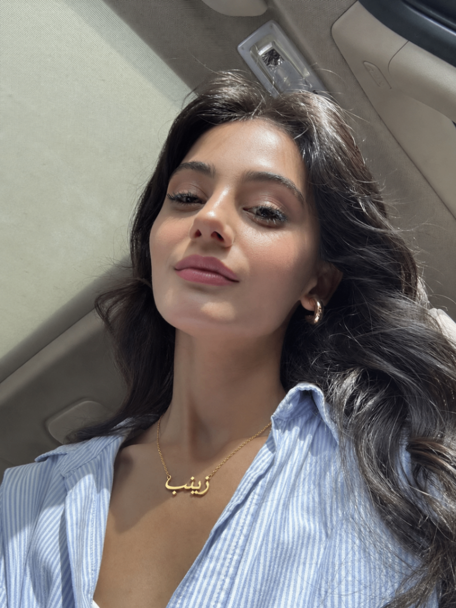 Zainab wearing a personalized necklace